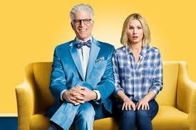 Ted Danson and Kristen BEll sitting on a couch as their characters in The Good Place